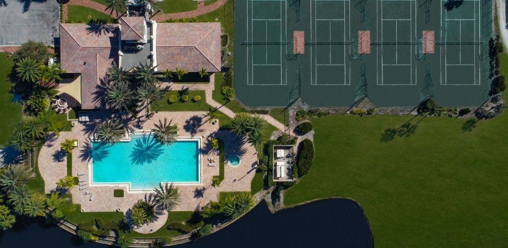 aerial of the tesoro club pool and tennis courts