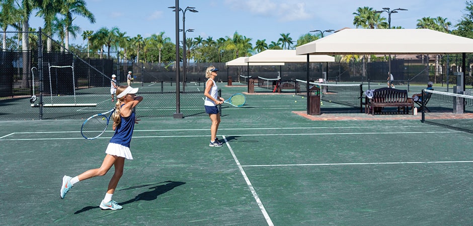 women playing tennis at tesoro club tennis courts