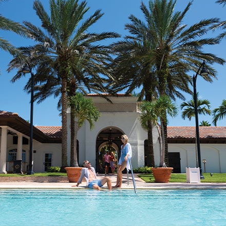 couple at the pool enjoying Florida's Treasure Coast Lifestyle